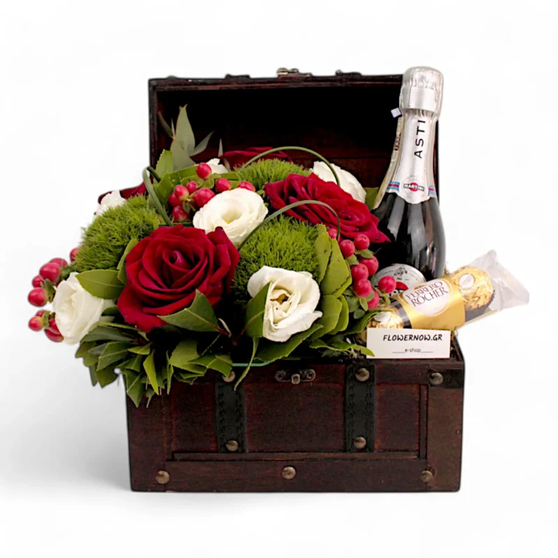 Μπαουλάκι με σαμπάνια και σύνθεση λουλουδιών/σοκολατάκια.
